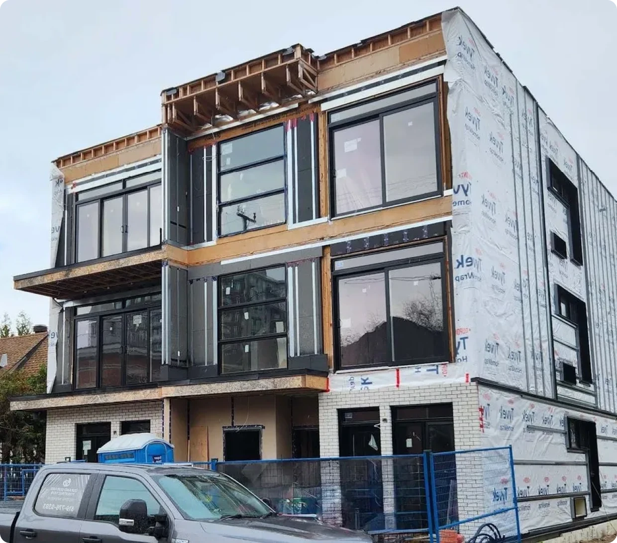 Urban residential construction site with vehicle