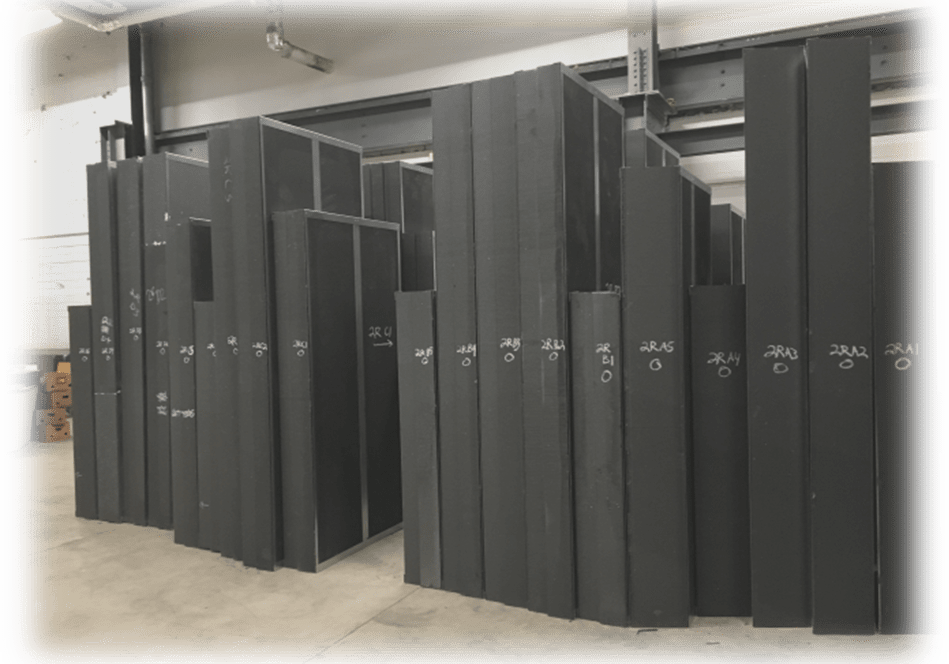 Rows of large, dark computer servers in a data center.